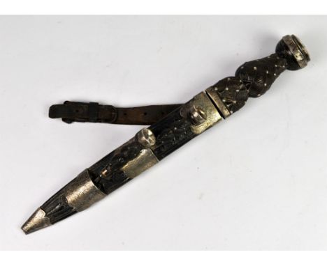 Late 19th century Scottish Sgain Dubh mounted with a citrine and corresponding smaller knife and fork, with carved wooden han