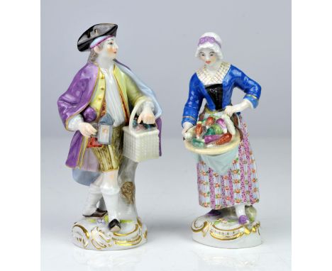 Pair of Meissen porcelain figures, late 19th/early 20th Century, modelled as a man wearing a purple cloak and holding a lante
