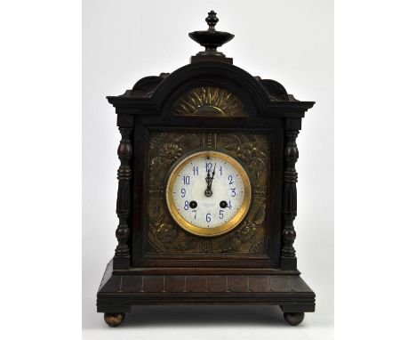 Aesthetic movement mahogany mantel clock, with inset brass panels of sunflowers, the two train movement striking on a coiled 