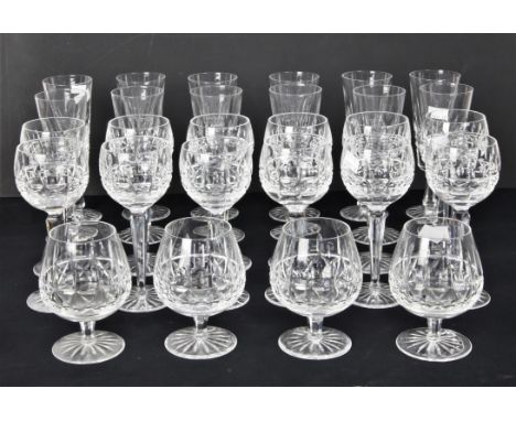 A part suite of Waterford glassware, etched marks to base, to comprise 12 flutes, 20 cm high, 12 hock glasses, 18.5cms high a