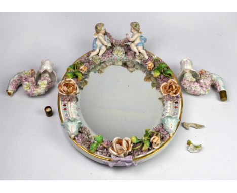 Sitzendorf style girandole with two branches surmounted by two putti, 42cm x 32cm