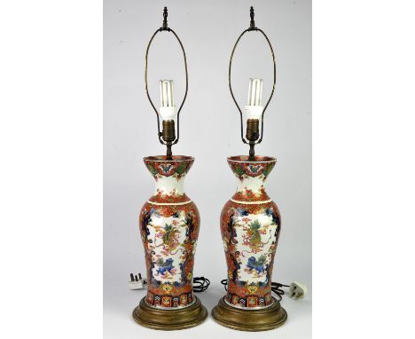 Pair of Chinese vases painted and enamelled with panels of a dragon flying above the ocean and another panel of two mythical 