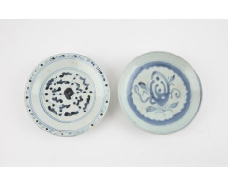 Two Chinese blue and white saucers, Ming dynasty. Boldly painted with flowers, 15.2 and 15.1 cm diameter      
