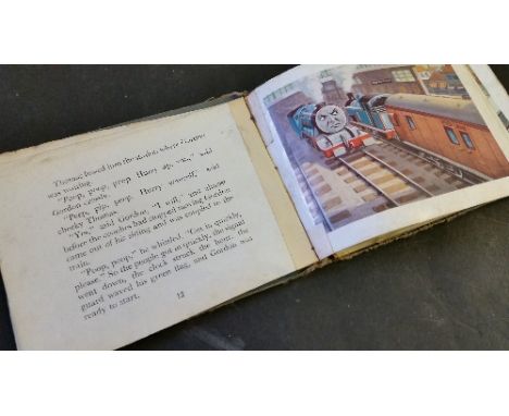 CHILDRENS BOOK, hardback edition of Thomas The Tank Engine by the Rev W Awdry, with blue boards and blue writing (stained), d