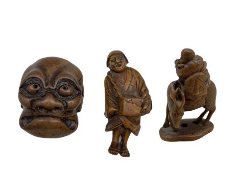 19th century Japanese boxwood netsuke in the form of a man playing the flute and riding on a deer, H4cm, another of a standin