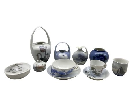 Two Royal Copenhagen porcelain cups and saucers, circular box and cover decorated with a Butterfly, posy basket decorated wit