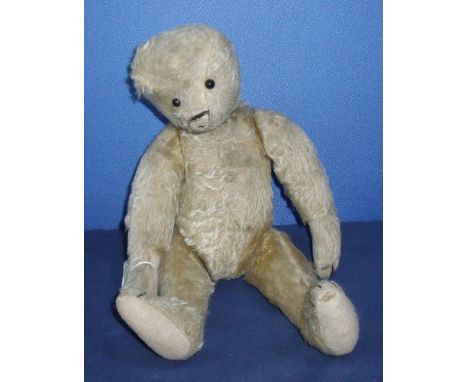 19th C mohair jointed bear with replacement felt pads, stitched paws, boot button eyes, remains of a stitched wool nose and h