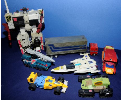 Small box of original Transformers including Optimus Prime, Start Ortobot Robot, Slapdash, Double Dealer etc.