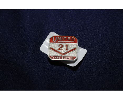 Enamel and silver hallmarked United 21 Years Service lapel badges no. 127