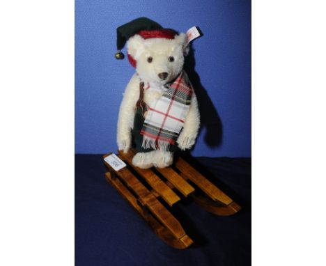 Steiff Winter Bear riding a sledge with button in ear in original box