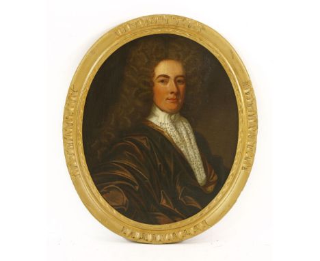 Manner of Sir Godfrey Kneller PORTRAIT OF A NOBLEMAN, HALF LENGTH, IN A WHITE STOCK AND BROWN COATOil on canvas, oval76 x 63c
