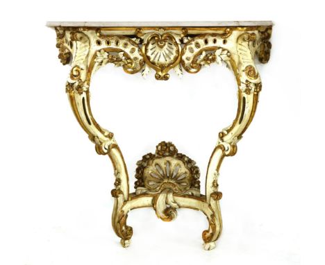 A Italianate painted and parcel gilt console table,19th century, the white marble top above pierced and carved frieze on cabr