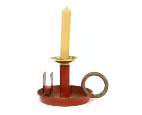 A novelty 'Giant' japanned and brass chamber candlestick and match case holder,19th century, similar to lot 834, and probably