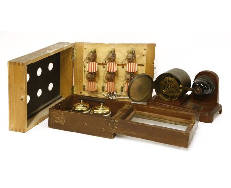 A rare Horstmanns patent electric fire switch,c.1910, on an oak base,21cm long,a double security light switch,in a stained wo