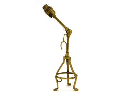 An Arts and Crafts brass combination electric table and wall light,in the manner of Benson,40cm high