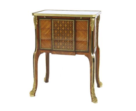 A Louis XVI-style parquetry and ormolu-mounted writing table, c.1900, the top inlaid with musical instruments, a bow and arro