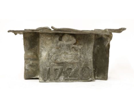 A George I lead rainwater hopper, with an applied figure and whale above the date '1720',52cm wide24cm high