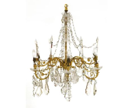A large gilt metal and cut-glass-mounted six-light electrolier, 19th century, festooned with hanging cut-glass drops, 100cm h