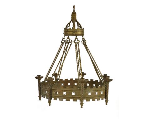 A Victorian brass Gothic seven-light chandelier, in the manner of A W Pugin, of ring form, complete with brass hanging rods