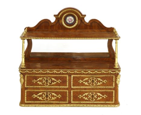 A kingwood and ormolu-mounted wall shelf, late 19th century, in the manner F Linke, the shaped crest with a porcelain roundel