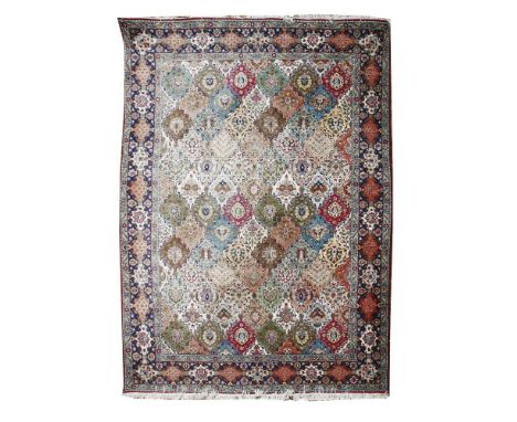 A large South Persian carpet,20th century, the field with repeating palmettes within a multiple banded border,290 x 390cm
