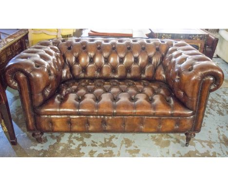 CHESTERFIELD SOFA, Victorian style deep buttoned upholstered in hand finished leaf brown leather with curved back and arms an