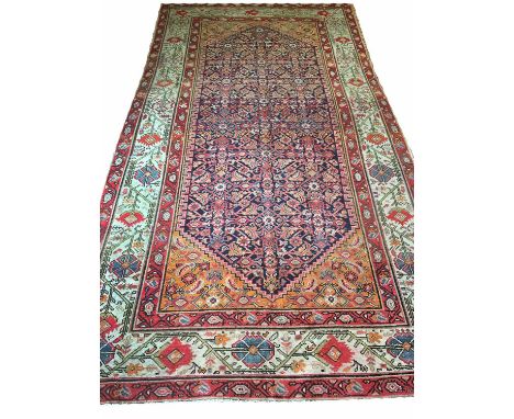 ANTIQUE PERSIAN MALAYER KELLEH CARPET, 300cm x 160cm, of stylised vines on sapphire field within amber spandrels and ivory bo