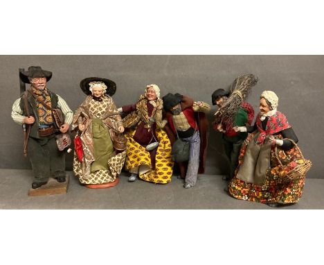 A selection of six French dolls or figures depicting country men and women.