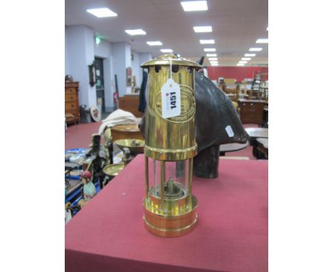A Brass Miners Lamp by E, Thomas &amp; Williams, Aberdare, Cambrian No 140879, 25.5cm high with handle down.