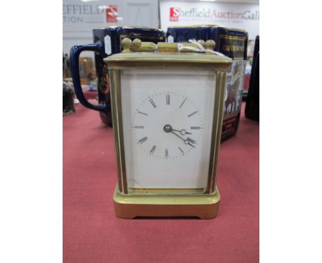 A Brass Carriage Clock, with carrying handle (cracks to face).