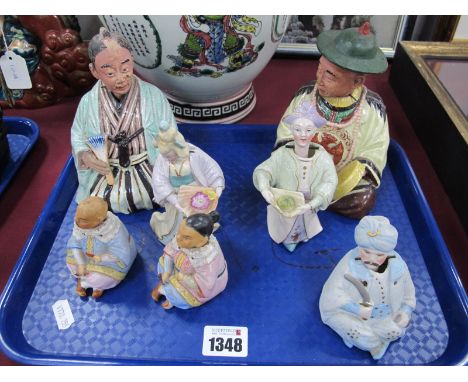 Seven Late XIX Century Ceramic Nodding Head Figures, all Oriental themed:- One Tray.