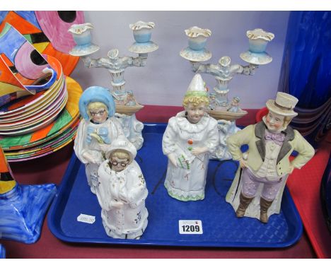Four Late XIX Century Ceramic Figures, each with nodding head, including clown together with a pair of twin branch candelabra
