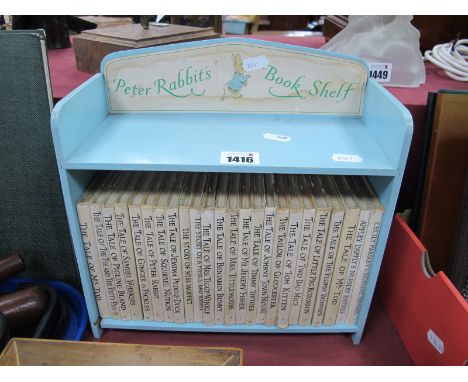 Peter Rabbits Book Shelf, twenty four books in a painted blue book shelf.