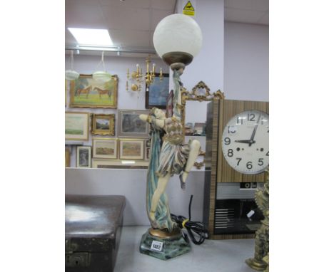 An Art Deco Style Lamp, modelled as a lady dancer holding a lamp aloft on hexagonal base.