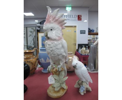 Royal Dux Ceramic Parrot, in pink and pastel tones, perched on naturalistic base, pink triangular applied plaque and stamped 