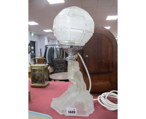 Art Deco Frosted Glass Table Lamp as a Lady Seated Upon a Rock, with chrome support to nonagonal shade, 35cm overall height.