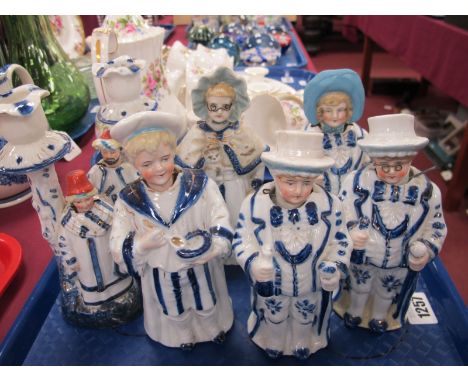 Seven Late XIX Century Ceramic Figurines, each with nodding head:- One Tray.