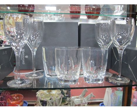 Waterford Crystal, four Eclipse white wine glasses, together with four eclipse tumblers, one chipped (boxed)