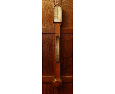 A Victorian mahogany stick barometer,the arched top with an ivory register over a silvered thermometer and turned cistern cov