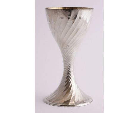 A modern silver goblet,  Robert Welch, London, 1990,the spirally fluted bowl with a trumpet shape stem and foot, a hammer fin