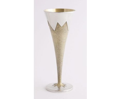 A modern parcel gilt silver goblet, Stuart Devlin, London, 1987,the funnel-shaped bowl with a matted surface over a circular 