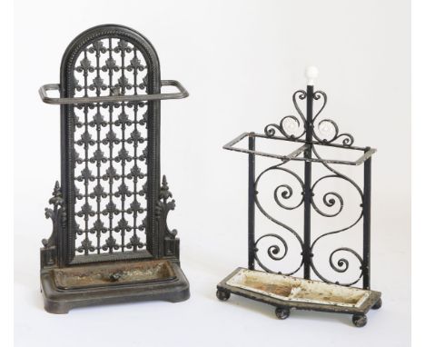 A Victorian cast iron stick stand,with a foliate pierced back and lift-out tray, registration lozenge to base,74cm high, anda