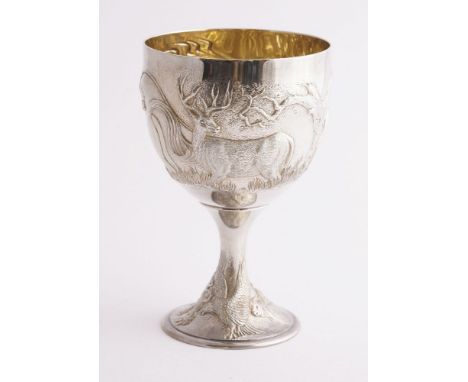 A modern silver goblet, Anthony G Elson, London, 1993,the circular bowl chased with horses, deer and quail, on a trumpet foot