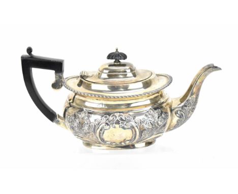 A late Victorian silver teapot by George Nathan &amp; Ridley Hayes, Chester 1900, the oval body with embossed floral design, 