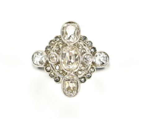 An Art Deco diamond cocktail ring, set with bezel set old mine cut diamonds, the central stone approx 0.5ct, stamped 18ct to 