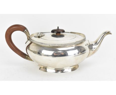 A George V silver teapot by Adie &amp; Bros, Birmingham 1934, retailed by Rowell of Oxford, of oval form with moulded rim, mo