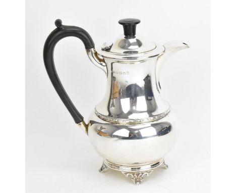 A George V silver hot water pot by A. L. Davenport Ltd, Birmingham 1934, of baluster form with ebonised turned finial and han