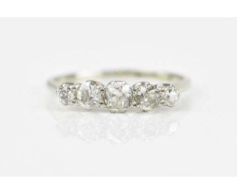 An 18ct white gold and five stone diamond ring, set with old cut diamonds of graduated sizes, the central stone approx 0.3 ca