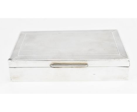 An Elizabeth II silver cigarette box by Cohen &amp; Charles, London 1963, retailed by Mappin &amp; Webb, of rectangular form 