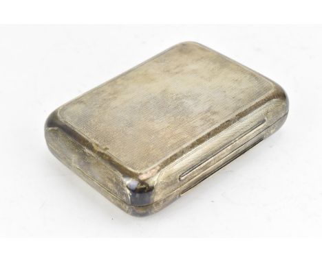 A Victorian silver cigar case by Thomas Johnson I, London 1872, of rectangular form with rounded corners, engine turned patte